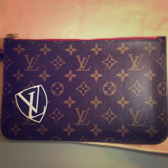 LV wristlet from World Tour collection. Authentic